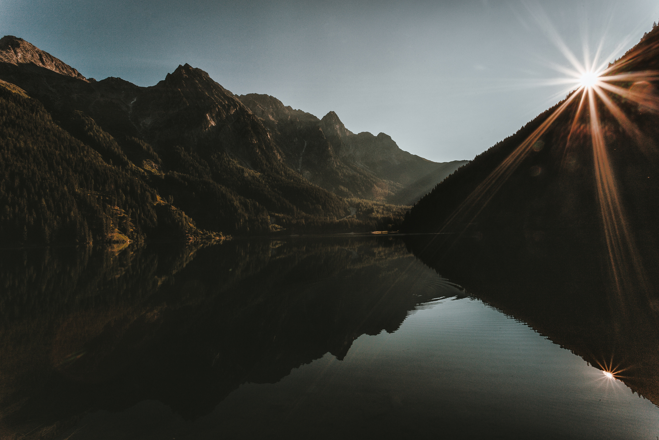 Landscape Photo of Mountains Under Gray Sky