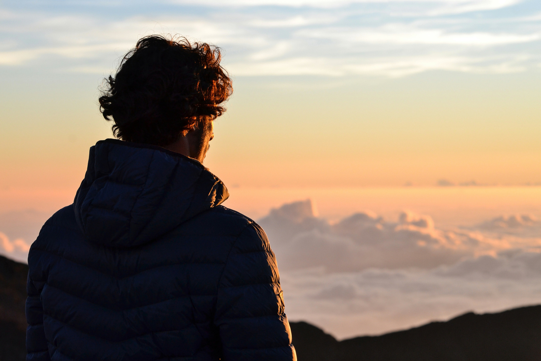 Man Looking into the Sky During Sunset